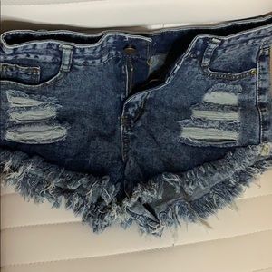 Ripped dark wash jean shorts